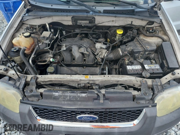 2003 Ford Escape XLT Popular with VIN 1FMYU03103KA06199, listed as a Copart auction lot 58731515 with 181,429 mi miles and Salvage title. Bid and sale history available at DreamBid. Image 12.