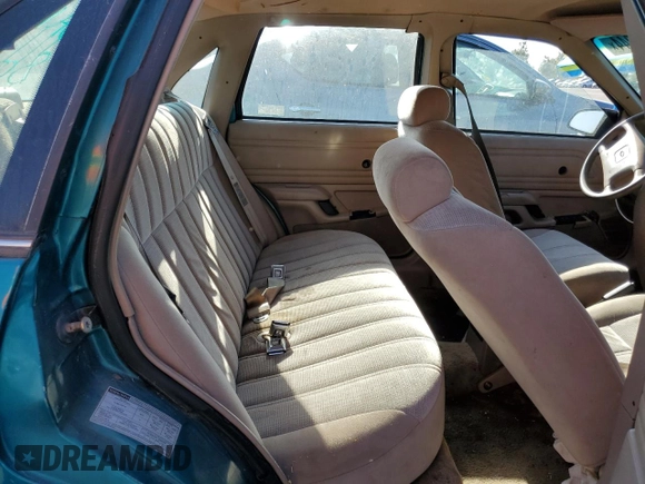 1993 Ford Tempo GL z VIN 2FAPP36X2PB168916, wystawiony jako Copart lot #63911044 z przebiegiem 30 114 mil mil oraz Czysty tytuł • Clean title. Historia ofert i sprzedaży dostępna na DreamBid. Obrazek 10.
