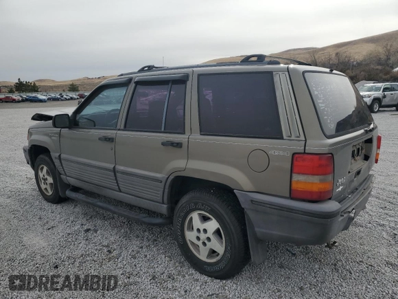 1995 Jeep Grand Cherokee Laredo with VIN 1J4GZ58S7SC743239, listed as a Copart auction lot 81717114 with 254,061 mi miles and Salvage Title. Bid and sale history available at carsss.com. Image 2.