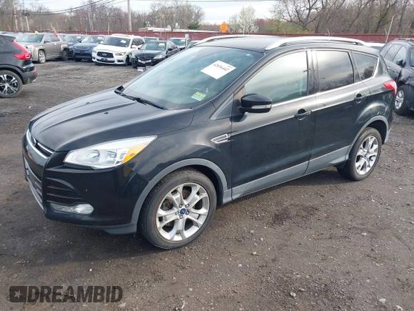 2014 Ford Escape Titanium with VIN 1FMCU9J98EUD73818, listed as a IAAI auction lot 42036442 with 129,794 mi miles. Bid and sale history available at carsss.com. Image 2.