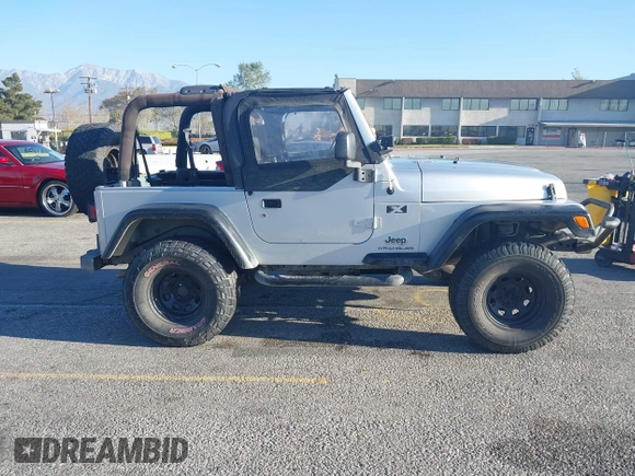 2005 Jeep Wrangler X with VIN 1J4FA39S55P348432, listed as a IAAI auction lot 41868451 with 166,876 mi miles. Bid and sale history available at carsss.com. Image 13.