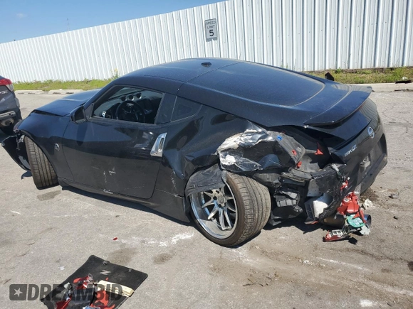 2009 Nissan 370Z Touring with VIN JN1AZ44EX9M407369, listed as a Copart auction lot 66755474 with 124,031 mi miles and Salvage Title. Bid and sale history available at carsss.com. Image 2.