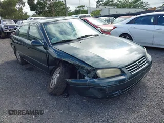 1999 Toyota Camry LE z VIN JT2BF22K2X0164080, wystawiony jako IAAI lot #40984874 z przebiegiem Nie podano mil oraz . Historia ofert i sprzedaży dostępna na DreamBid. Obrazek 1.
