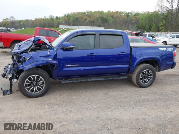2023 Toyota Tacoma SR z VIN 3TMCZ5AN1PM589061, wystawiony jako IAAI lot #41936717 z przebiegiem 41 395 mil mil oraz . Historia ofert i sprzedaży dostępna na DreamBid. Obrazek 14.