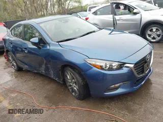 2018 Mazda 3 Touring with VIN 3MZBN1V35JM217641, listed as a IAAI auction lot 41943433 with 64,884 mi miles. Bid and sale history available at carsss.com. Image 1.