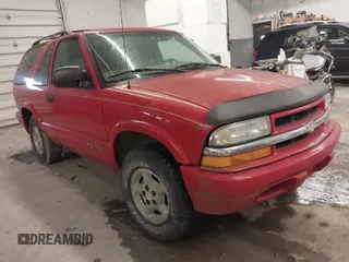 2000 Chevrolet Blazer LS z VIN 1GNCT18WXYK264109, wystawiony jako IAAI lot #42047484 z przebiegiem Nie podano mil oraz . Historia ofert i sprzedaży dostępna na DreamBid. Obrazek 1.