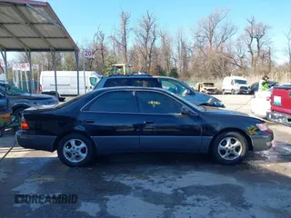 1997 Lexus ES 300 Luxury Sport Sdn with VIN JT8BF22GXV5003056, listed as a IAAI auction lot 41806886 with 130,063 mi miles. Bid and sale history available at carsss.com. Image 13.