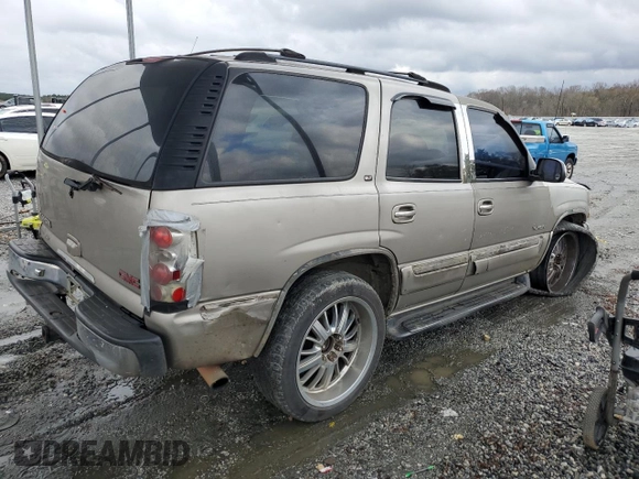 2001 GMC Yukon SLT z VIN 1GKEC13T51J145673, wystawiony jako Copart lot #83568954 z przebiegiem 310 415 mil mil oraz Szkoda całkowita • Salvage title. Historia ofert i sprzedaży dostępna na DreamBid. Obrazek 3.