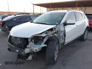 2015 Cadillac SRX with VIN 3GYFNAE34FS557297, listed as a IAAI auction lot 41388573 with 124,185 mi miles and . Bid and sale history available at DreamBid. Image 2.