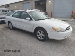 2003 Ford Taurus SE z VIN 1FAFP58S63A158422, wystawiony jako IAAI lot #41933813 z przebiegiem 71 990 mil mil oraz . Historia ofert i sprzedaży dostępna na DreamBid. Obrazek 1.