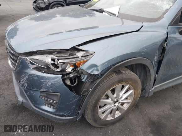 2016 Mazda CX-5 Touring z VIN JM3KE2CY2G0699138, wystawiony jako IAAI lot #42153228 z przebiegiem 144 191 mil mil oraz . Historia ofert i sprzedaży dostępna na DreamBid. Obrazek 6.