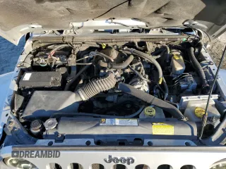 2011 Jeep Wrangler Sahara with VIN 1J4GA5D14BL628876, listed as a Copart auction lot 87317374 with 84,179 mi miles and Salvage Title. Bid and sale history available at DreamBid. Image 11.
