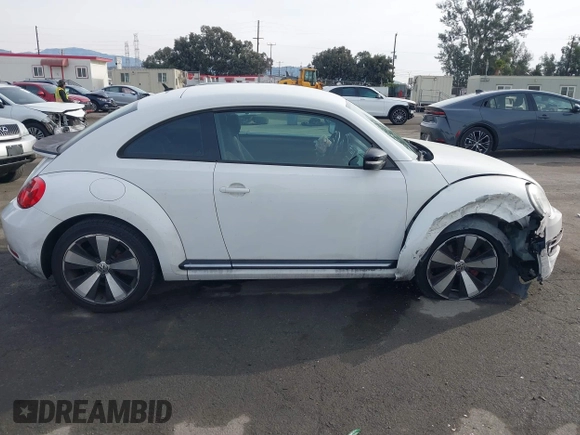 2012 Volkswagen Beetle 2.0T Turbo w/Sun/Snd/Nav PZEV with VIN 3VWVA7ATXCM620731, listed as a IAAI auction lot 41074530 with 99,236 mi miles. Bid and sale history available at carsss.com. Image 13.