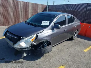 2015 Nissan Versa S Plus with VIN 3N1CN7AP9FL809885, listed as a IAAI auction lot 41969634 with 111,715 mi miles. Bid and sale history available at carsss.com. Image 2.