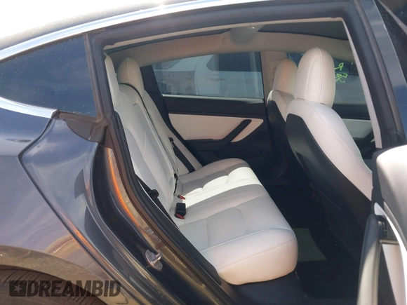 2019 Tesla Model 3 Mid Range with VIN 5YJ3E1EA5KF327679, listed as a IAAI auction lot 41804379 with 87,208 mi miles and . Bid and sale history available at DreamBid. Image 8.