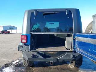 2009 Jeep Wrangler Sahara z VIN 1J4FA54199L722192, wystawiony jako IAAI lot #41619305 z przebiegiem 105 545 mil mil oraz . Historia ofert i sprzedaży dostępna na DreamBid. Obrazek 16.