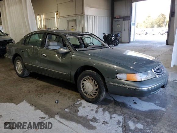 1997 Lincoln Continental with VIN 1LNLM97VXVY624609, listed as a Copart auction lot 73921634 with 119,746 mi miles and Salvage Title. Bid and sale history available at carsss.com. Image 4.