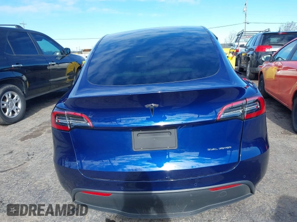 2022 Tesla Model Y Long Range with VIN 7SAYGDEE6NF318372, listed as a IAAI auction lot 41526857 with 26,083 mi miles and . Bid and sale history available at carsss.com. Image 16.