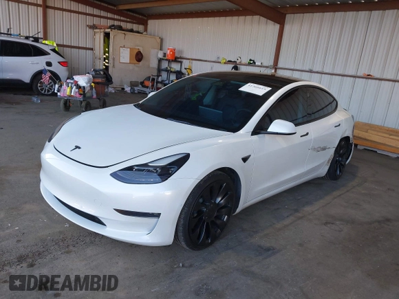 2021 Tesla Model 3 Performance with VIN 5YJ3E1EC4MF097993, listed as a IAAI auction lot 41366615 with 30,735 mi miles and . Bid and sale history available at DreamBid. Image 2.