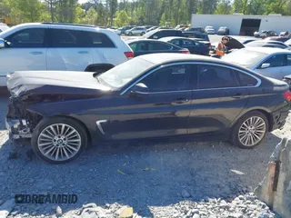 2015 BMW 4 Series 428i with VIN WBA4A5C51FG051393, listed as a IAAI auction lot 42041960 with 136,929 mi miles and . Bid and sale history available at carsss.com. Image 14.