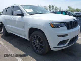 2021 Jeep Grand Cherokee Overland z VIN 1C4RJFCG6MC592296, wystawiony jako IAAI lot #42170899 z przebiegiem 56 553 mil mil oraz . Historia ofert i sprzedaży dostępna na DreamBid. Obrazek 1.
