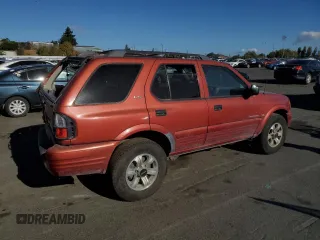 2001 Isuzu Rodeo S with VIN 4S2CK58W014302125, listed as a Copart auction lot 76425614 with 204,350 mi miles and Salvage title. Bid and sale history available at DreamBid. Image 3.