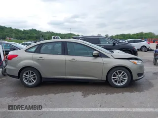 2016 Ford Focus SE z VIN 1FADP3F26GL332224, wystawiony jako IAAI lot #42167222 z przebiegiem 134 423 mil mil oraz . Historia ofert i sprzedaży dostępna na DreamBid. Obrazek 13.