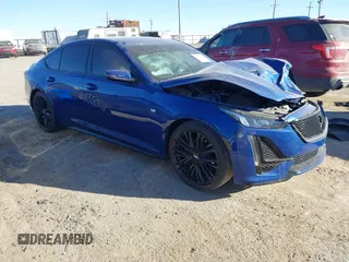 2021 Cadillac CT5 Sport z VIN 1G6DP5RK9M0120788, wystawiony jako IAAI lot #41212510 z przebiegiem 27 200 mil mil oraz . Historia ofert i sprzedaży dostępna na DreamBid. Obrazek 1.