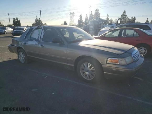 2005 Ford Crown Victoria LX with VIN 2FAFP74W75X129929, listed as a Copart auction lot 89020125 with 156,115 mi miles and Salvage Title. Bid and sale history available at carsss.com. Image 4.