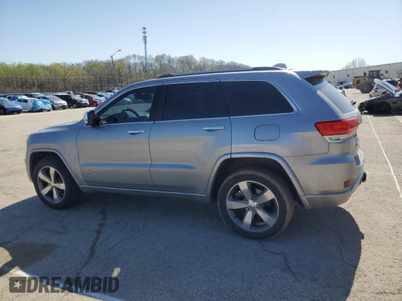 2014 Jeep Grand Cherokee Overland with VIN 1C4RJFCG0EC542527, listed as a Copart auction lot 51776655 with 167,703 mi miles and Salvage Title. Bid and sale history available at DreamBid. Image 2.