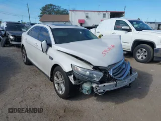 2015 Ford Taurus SEL z VIN 1FAHP2E81FG105404, wystawiony jako IAAI lot #40888773 z przebiegiem Nie podano mil oraz . Historia ofert i sprzedaży dostępna na DreamBid. Obrazek 1.