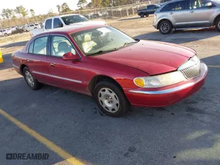1999 Lincoln Continental with VIN 1LNHM97V8XY633821, listed as a IAAI auction lot 41769620 with 268,617 mi miles. Bid and sale history available at carsss.com. Image 1.