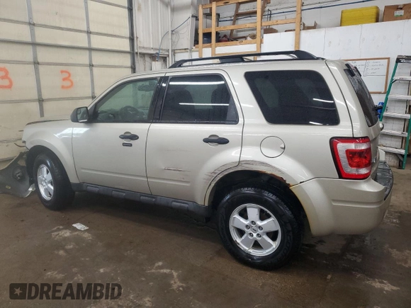 2012 Ford Escape XLT with VIN 1FMCU9D76CKC44981, listed as a Copart auction lot 57908795 with 127,594 mi miles and Salvage title. Bid and sale history available at DreamBid. Image 2.