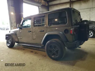 2020 Jeep Wrangler Unlimited Black and Tan with VIN 1C4HJXDG9LW331418, listed as a Copart auction lot 56414765 with 125,339 mi miles and Salvage title. Bid and sale history available at DreamBid. Image 2.