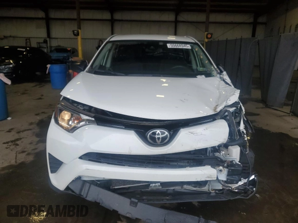 2018 Toyota RAV4 LE with VIN JTMBFREV2JJ182828, listed as a Copart auction lot 55668945 with 164,683 mi miles and Salvage Title. Bid and sale history available at DreamBid. Image 5.