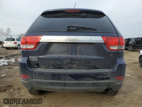 2013 Jeep Grand Cherokee Laredo with VIN 1C4RJEAG1DC584166, listed as a Copart auction lot 52785975 with 210,961 mi miles and Clean Title. Bid and sale history available at carsss.com. Image 6.