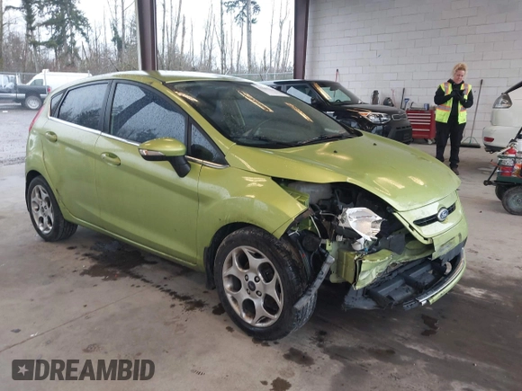 2011 Ford Fiesta SES with VIN 3FADP4FJ7BM127600, listed as a IAAI auction lot 41657170 with 135,483 mi miles. Bid and sale history available at carsss.com. Image 1.