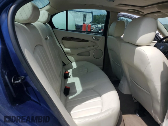 2004 Jaguar X-Type with VIN SAJEA51C44WD83361, listed as a Copart auction lot 55643545 with 54,615 mi miles and Salvage Title. Bid and sale history available at DreamBid. Image 10.