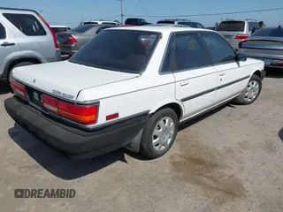 1990 Toyota Camry z VIN JT2SV21E9L0352085, wystawiony jako IAAI lot #42419588 z przebiegiem 138 425 mil mil oraz . Historia ofert i sprzedaży dostępna na DreamBid. Obrazek 4.