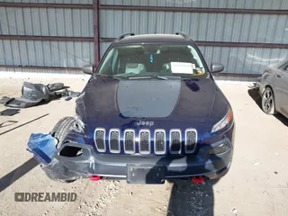 2015 Jeep Cherokee Trailhawk with VIN 1C4PJMBB1FW520649, listed as a IAAI auction lot 41991904 with 168,533 mi miles and . Bid and sale history available at DreamBid. Image 13.