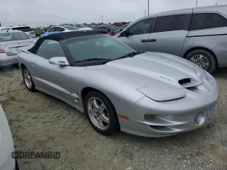 2002 Pontiac Firebird Trans Am z VIN 2G2FV32GX22126136, wystawiony jako Copart lot #74893254 z przebiegiem 7725 mil mil oraz Szkody całkowita. Historia ofert i sprzedaży dostępna na DreamBid. Obrazek 4.