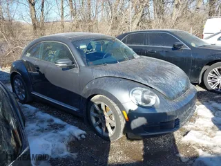 2012 Volkswagen Beetle 2.5L PZEV with VIN 3VWJP7AT0CM630116, listed as a IAAI auction lot 41401663 with 150,674 mi miles. Bid and sale history available at carsss.com. Image 1.
