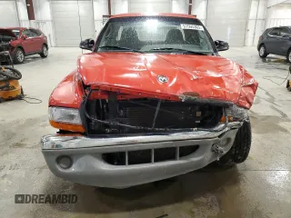 2000 Dodge Dakota Sport z VIN 1B7GL22N5YS674686, wystawiony jako Copart lot #57595365 z przebiegiem 109 685 mil mil oraz Szkody całkowita. Historia ofert i sprzedaży dostępna na DreamBid. Obrazek 5.