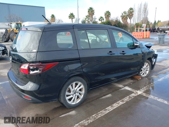 2015 Mazda 5 Sport z VIN JM1CW2BL1F0184498, wystawiony jako IAAI lot #39903933 z przebiegiem 90 905 mil mil oraz . Historia ofert i sprzedaży dostępna na DreamBid. Obrazek 4.