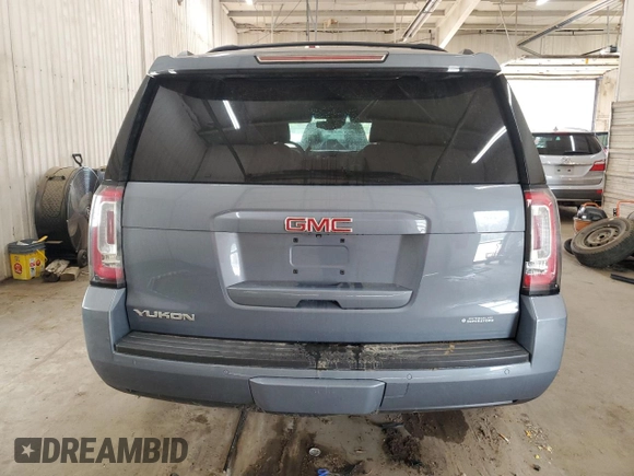 2015 GMC Yukon SLT z VIN 1GKS2BKC0FR630731, wystawiony jako Copart lot #55359445 z przebiegiem Nie podano mil oraz Szkoda całkowita • Salvage title. Historia ofert i sprzedaży dostępna na DreamBid. Obrazek 6.
