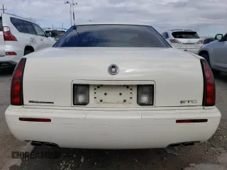2002 Cadillac Eldorado z VIN 1G6EC12912B106675, wystawiony jako Copart lot #47630055 z przebiegiem 75 354 mil mil oraz Nie do naprawy • Non repairable. Historia ofert i sprzedaży dostępna na DreamBid. Obrazek 6.
