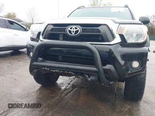 2015 Toyota Tacoma with VIN 3TMLU4ENXFM185371, listed as a IAAI auction lot 41952513 with 87,128 mi miles and . Bid and sale history available at DreamBid. Image 6.