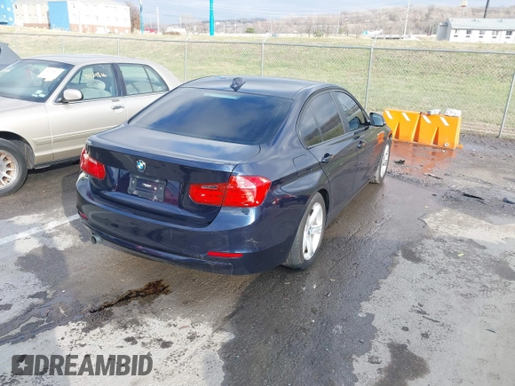 2013 BMW 3 Series 320i with VIN WBA3B1C58DK129051, listed as a IAAI auction lot 41119380 with 101,427 mi miles. Bid and sale history available at carsss.com. Image 4.