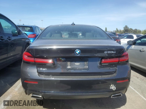 2023 BMW 5 Series 530e with VIN WBA13AG00PCL24045, listed as a Copart auction lot 84961634 with Not provided miles and Salvage title. Bid and sale history available at DreamBid. Image 6.