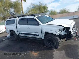 2019 Toyota Tacoma SR z VIN 3TMCZ5AN6KM284101, wystawiony jako IAAI lot #41099466 z przebiegiem 36 119 mil mil oraz . Historia ofert i sprzedaży dostępna na DreamBid. Obrazek 13.